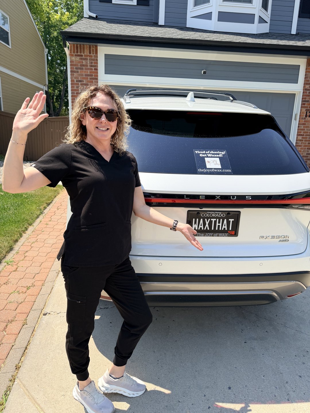 Robyn in front of her Lexus with WAXTHAT license plate